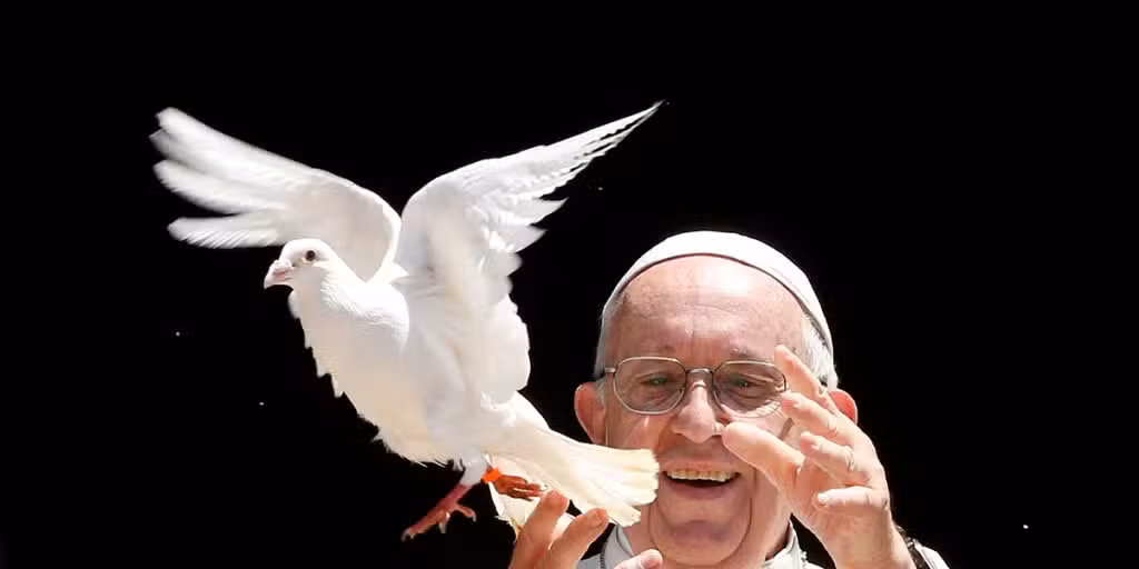 Pope Francis releases a dove.