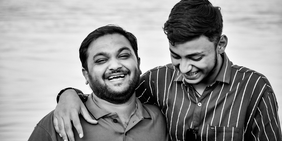 two friends laughing together being present and listening