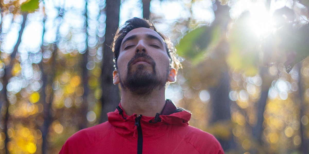 man taking a deep breath