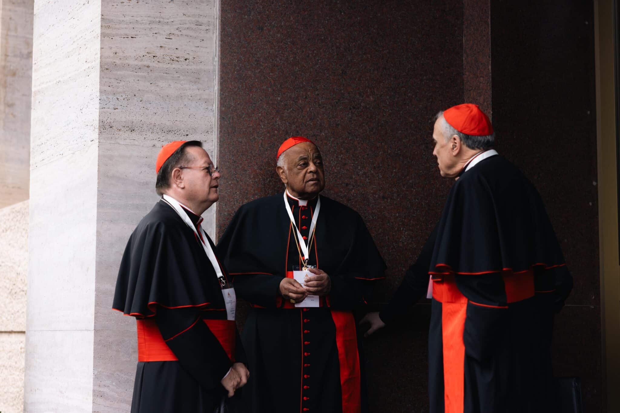 Cardinals Gérald C. Lacroix of Québec, Wilton D. Gregory, retired archbishop of Washington, and Daniel N. DiNardo, retired archbishop of Galveston-Houston, speak outside the Pontifical North American College in Rome May 5, 2025.