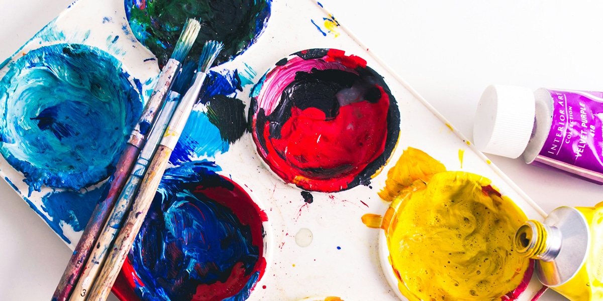 Different color paint and paintbrushes