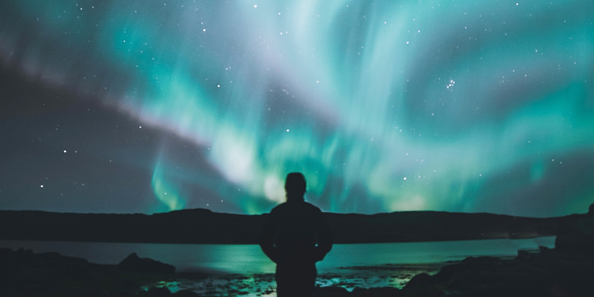 Person looking into the never ending night sky