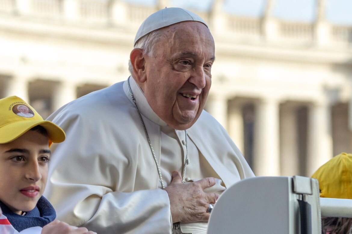 Pope Francis greets visitors as he rides the popemobile around St. Peter's Square before his weekly general audience at the Vatican Nov. 27, 2024. (CNS photo/Lola Gomez)