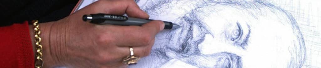 A woman sketches a drawing of Saint Padre Pio