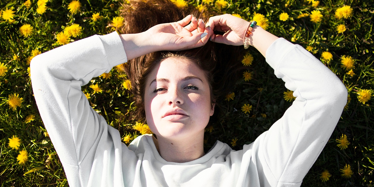 woman resting in grass